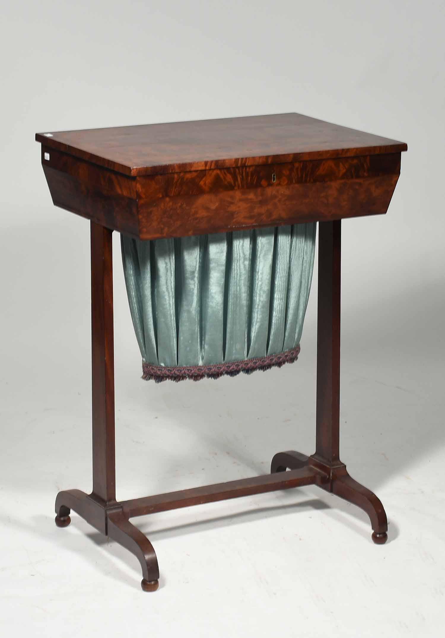 Federal Mahogany Lift Top Sewing Stand: Federal mahogany lift top sewing stand, ca. 1825, banded lift top, opening to reveal a blue aper and fabric lined yarn reservoir, medial stretcher, ending in ball feet. 32"H x 15.5"L. x 22"W.