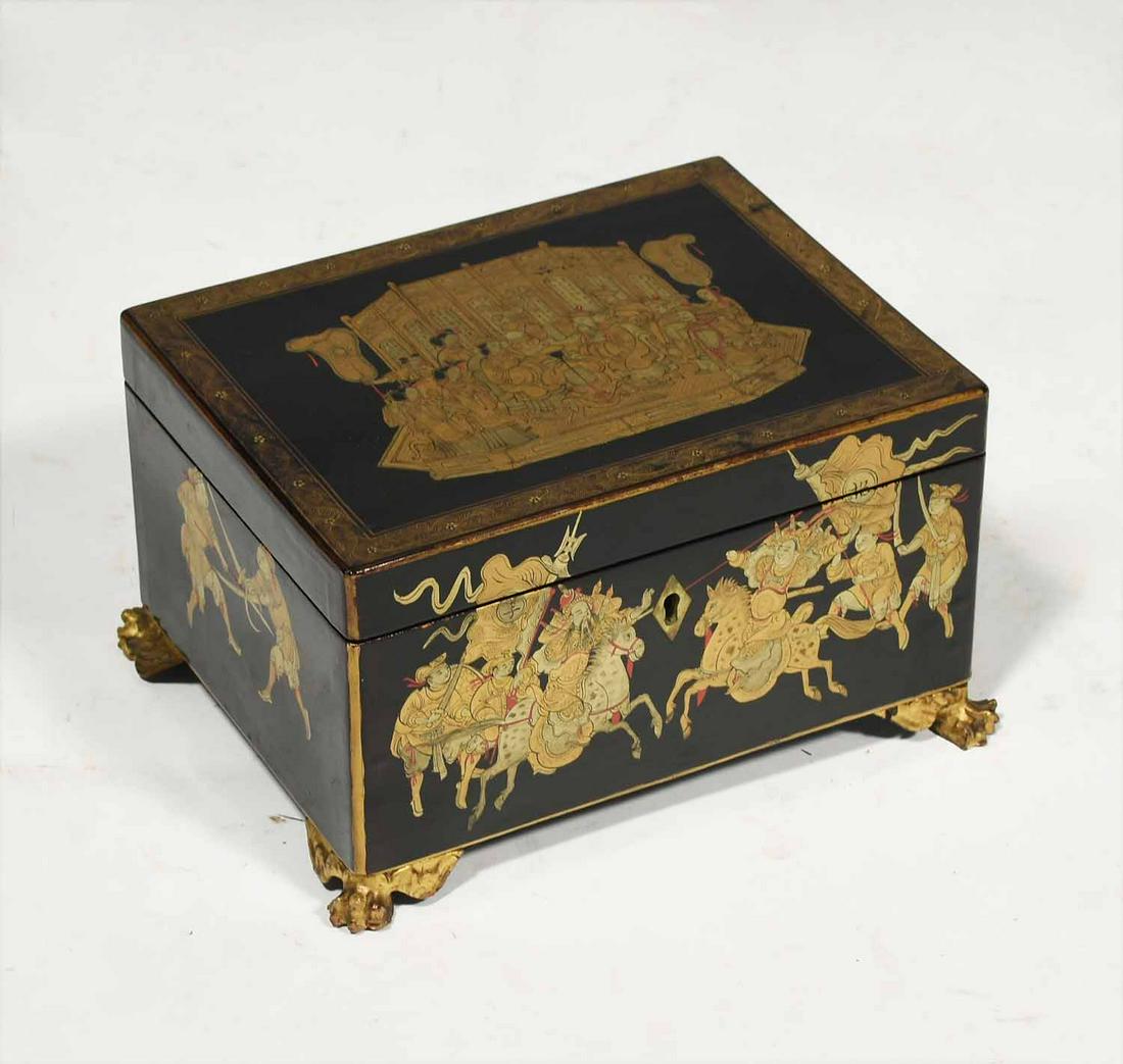 19th C. China trade chinoiserie tea caddy: 19th C. China trade chinoiserie tea caddy, rectangular box with black lacquerware and painted gilt work decoration opening to a chased pewter interior on carved and gilt paw feet, ca 1830, 8”L x