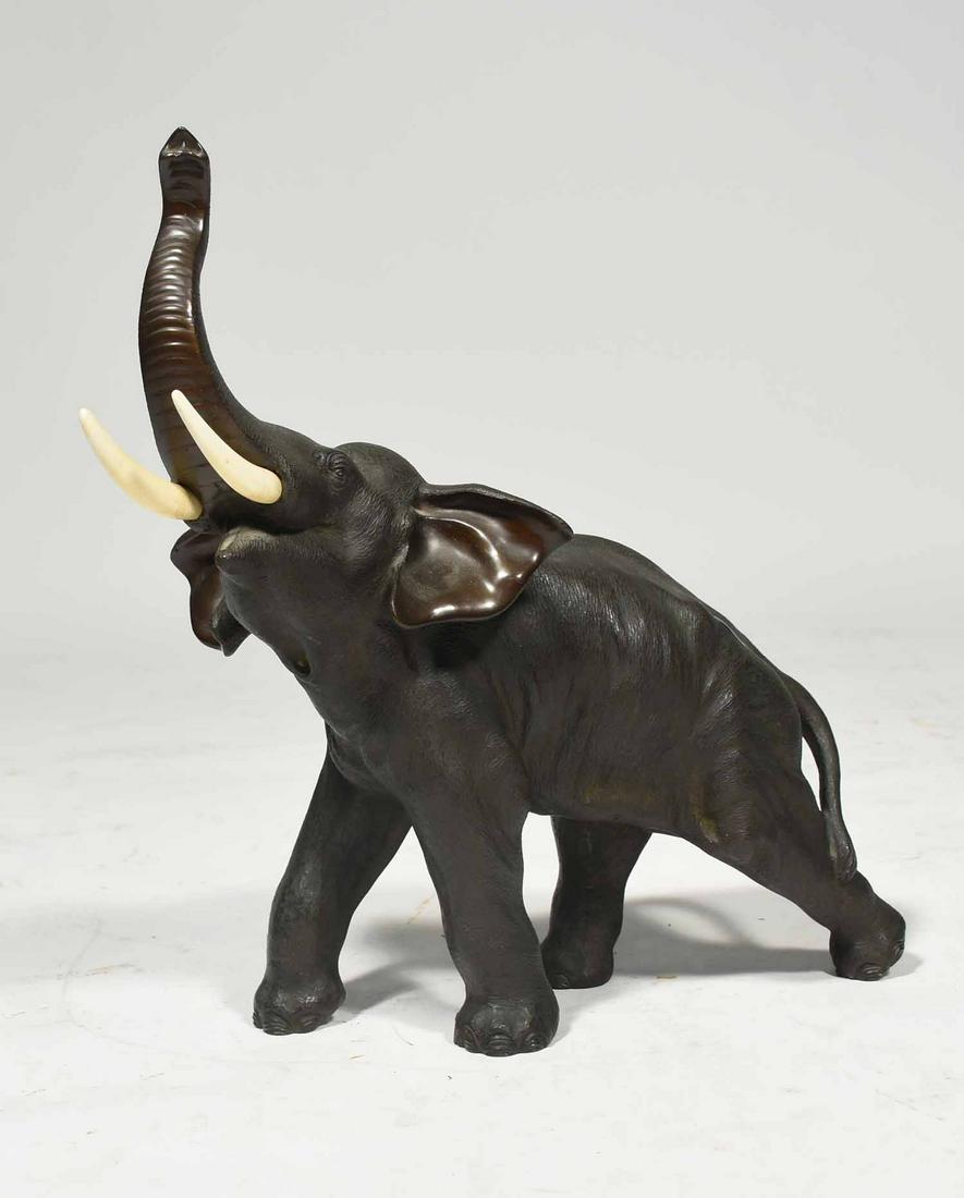Japanese Meji Bronze Elephant: Japanese Meji bronze elephant rearing trunk, ca. 1900, signed on bottom, 13”L x 14”H.