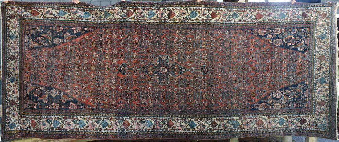 Oriental room size rug: Oriental room size rug, light red and navy pattern with an ivory border. 7’ x 17’4”