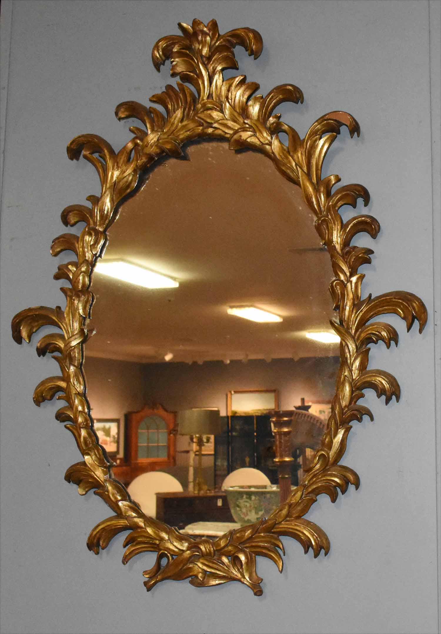 19th C. French Carved Gilt Mirror: Late 19th/early 20th C. French carved wooden, gesso and gilt painted mirror with scrolling plume carvings, 40"H. X 31"W.