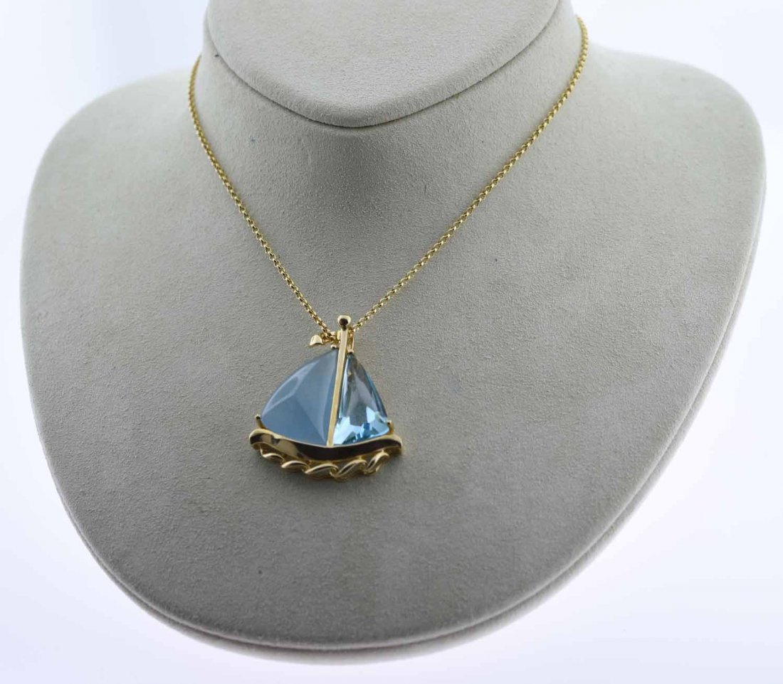 14k blue topaz sailboat pendant and chain: 14k blue topaz sailboat pendant and chain, 20" L, 14 grams height of pendant 1.25".