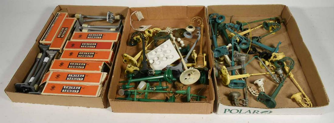 Lionel light poles: Lionel light poles, many different kinds, colors, some boxes. 3 flats.