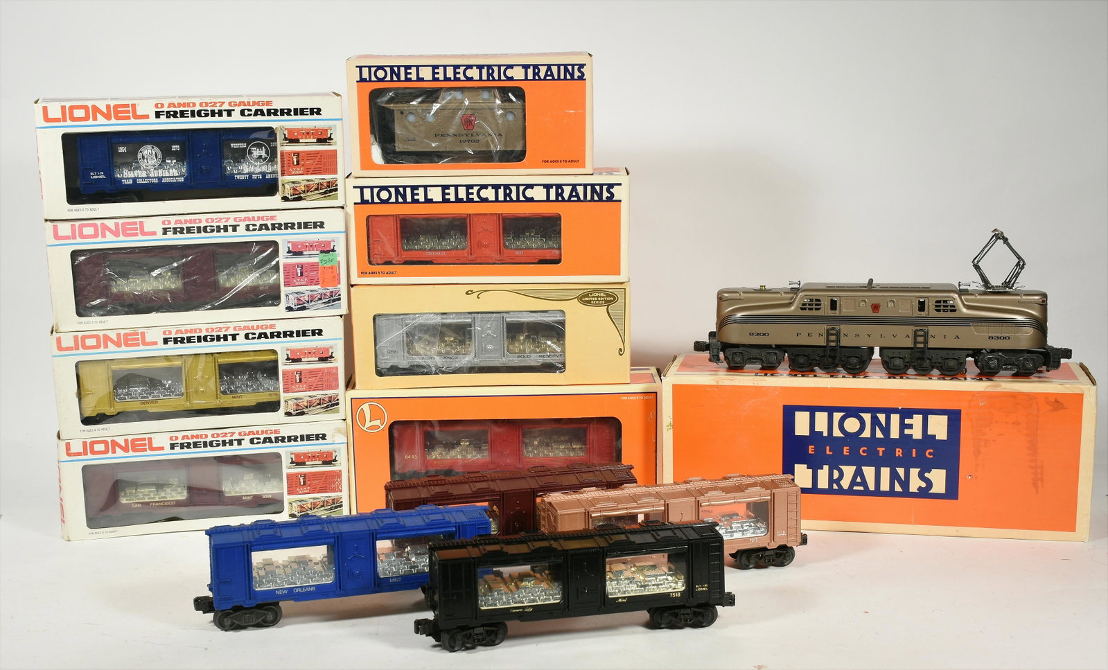 Lionel 18300 PRR GG-1 Electric Locomotive$300-600: Lionel 18300 PRR GG-1 Electric Locomotive, 9320 Fork Knox, 9319, 9677, 7530, (2) 9349, 7515, 7517, 7522, 7518, 9349, (11) Mint Cars, 19702 Caboose Boxes.