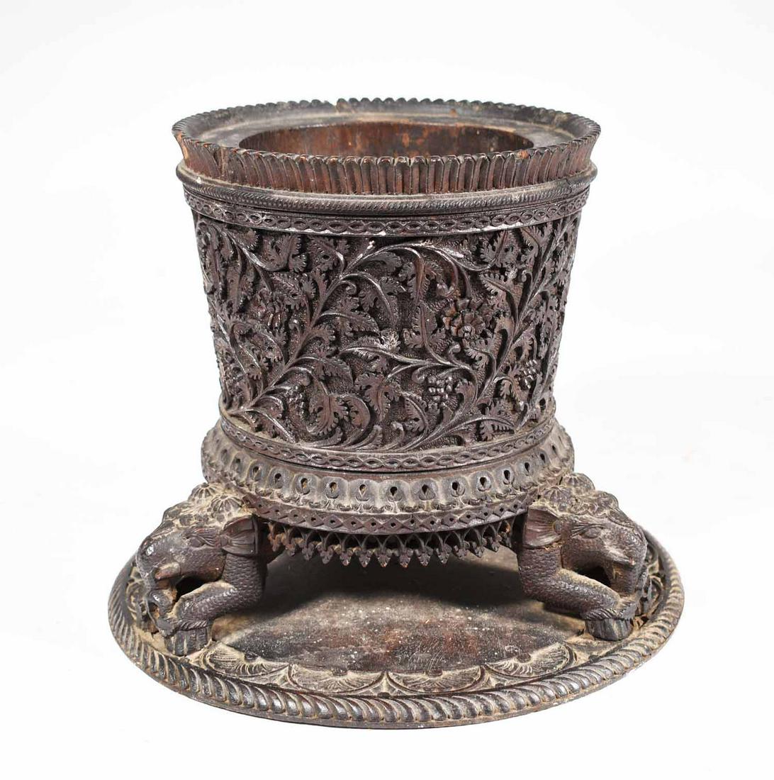 Carved tri-foot vessel India: 19th C. carved wood censer from India, Hard wood nicely carved floral relief with tri- foot elephant motifs, 9” H x 7”D top attached to carved circular base