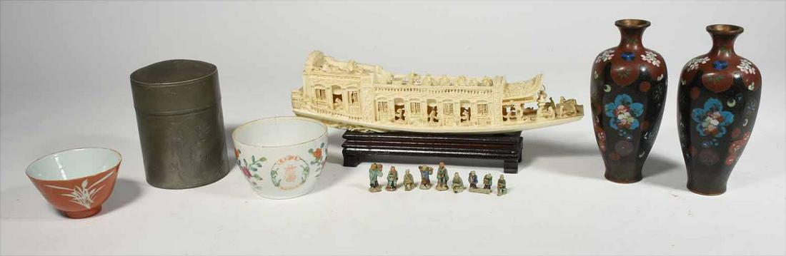 Asian collectibles: Grouping of Asian items including carved boat, pair of cloisonné vases, pewter advertising can, export porcelain, etc.Boat 14” L and vases, 7.5” H.