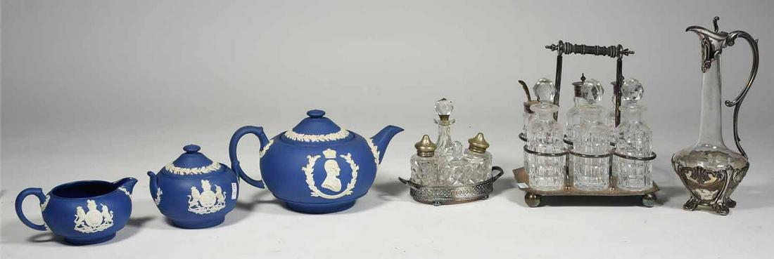 Decorative accessories: Royal blue Jasperware Wedgwood tea set along with “800” silver and glass ewer and two silver plated castor/condiment sets. Ewer, 9.5” H. castor set, 6”H. Teapot, 5”H.