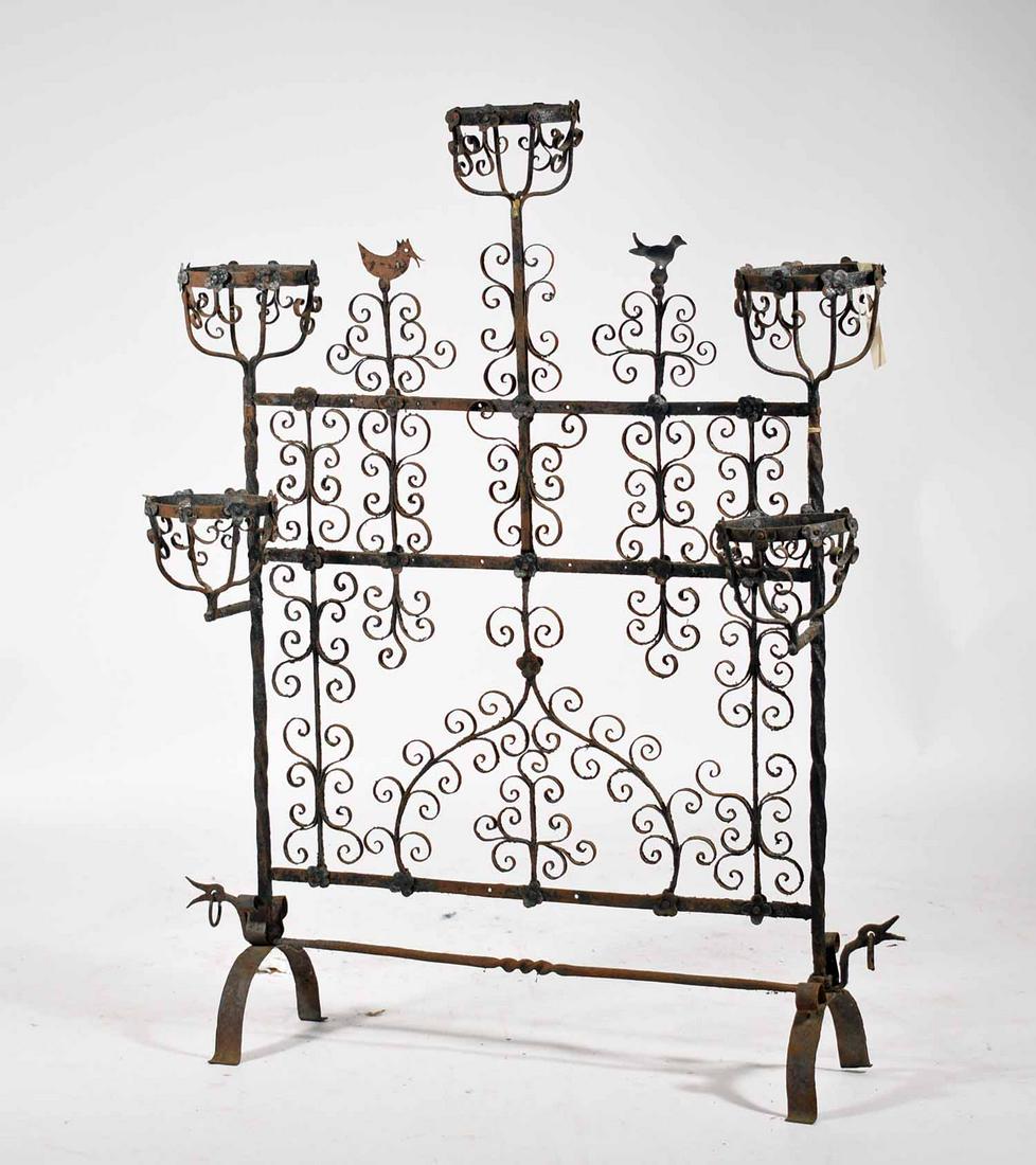 Ornate iron fireplace screen with pot holders: Ornate iron fireplace screen with pot holders, Scroll work with bird motifs on arched feet, 45”H x 35” W.