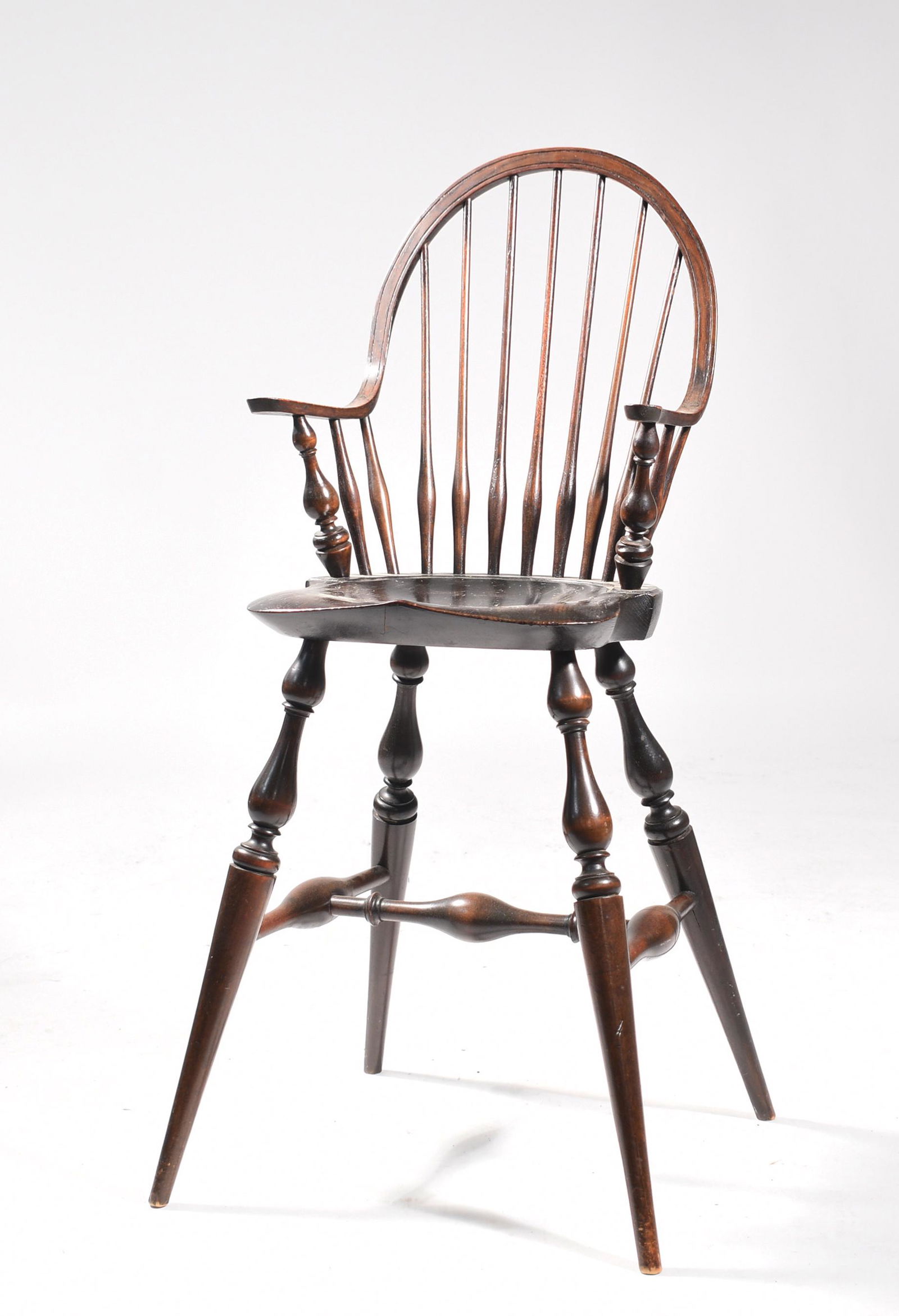 Wallace Nutting continous arm high chair: Wallace Nutting high chair, a continuous arm example with vase and ring turnings with Wallace Nutting paper label under seat, original finish, 36.5”H back seat 22”H x 14”W.