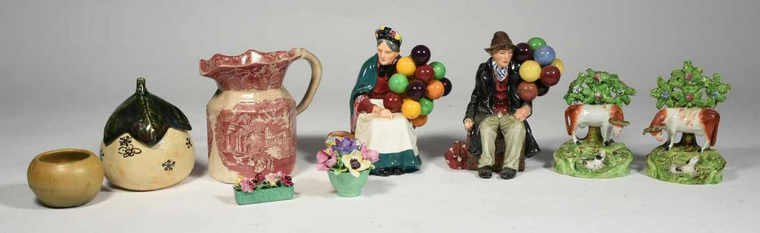 Collector’s lot: Royal Doulton, Staffordshire,: Assortment of collectible ceramics including two Royal Doulton figural groups, transferware pitcher, Staffordshire groups and art pottery, 9 pieces.