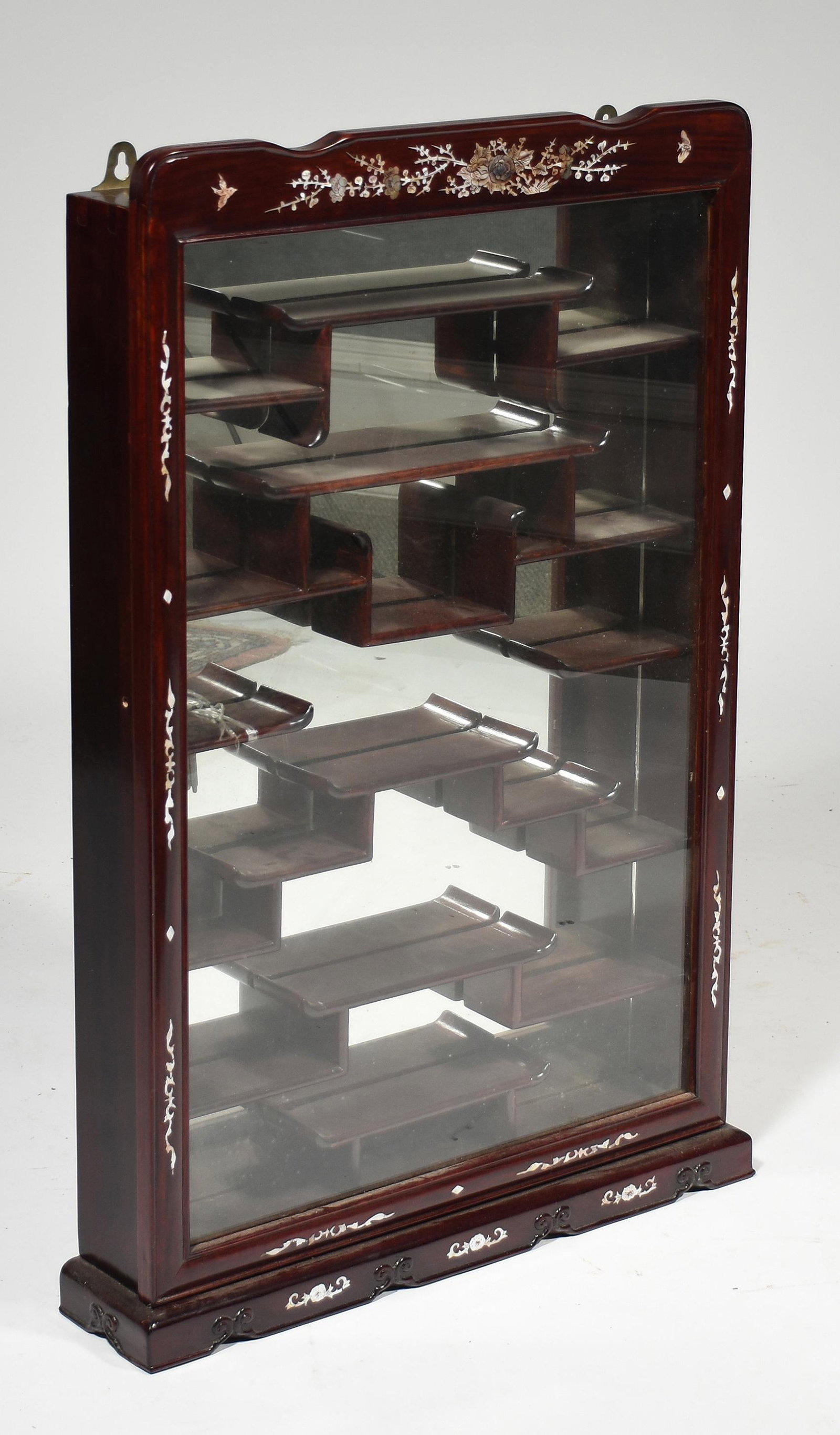Chinese 20th C rosewood hanging cabinet: Chinese 20th C inlaid rosewood hanging display cabinet inlaid with mother of pearl and mirrored interior, 32”H x 20” x 4”