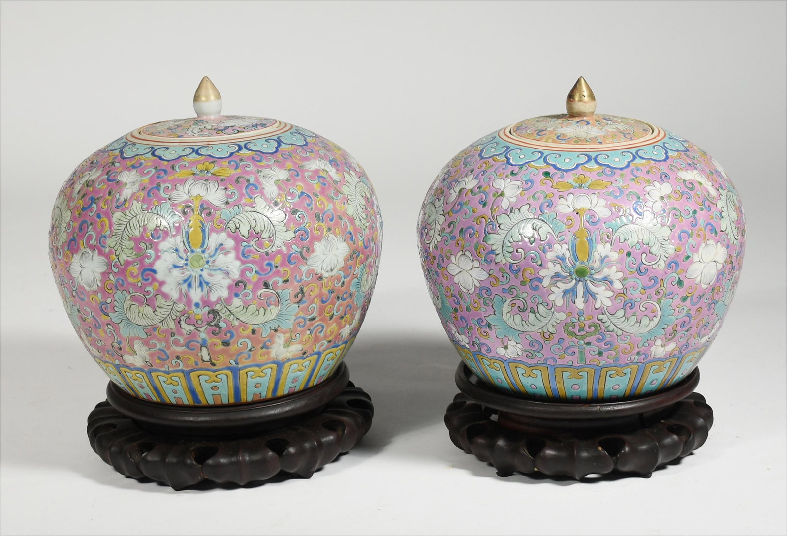 Pair of Chinese porcelain ginger jars: Pair of Chinese porcelain ginger jars with carved wood stands, 10"H. (Jars)