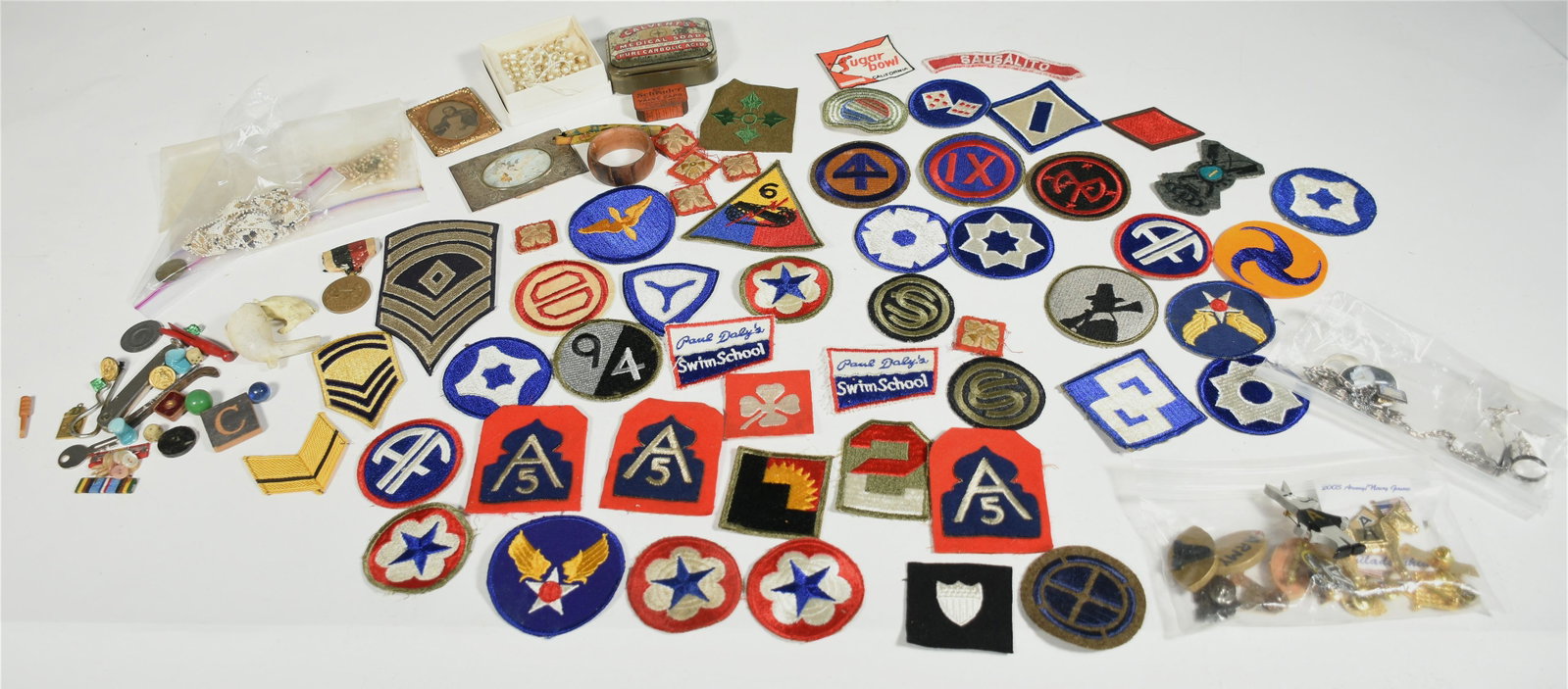 Assorted group of collectibles: Assorted group of collectibles including patches, medallions, silver jewelry, etc.