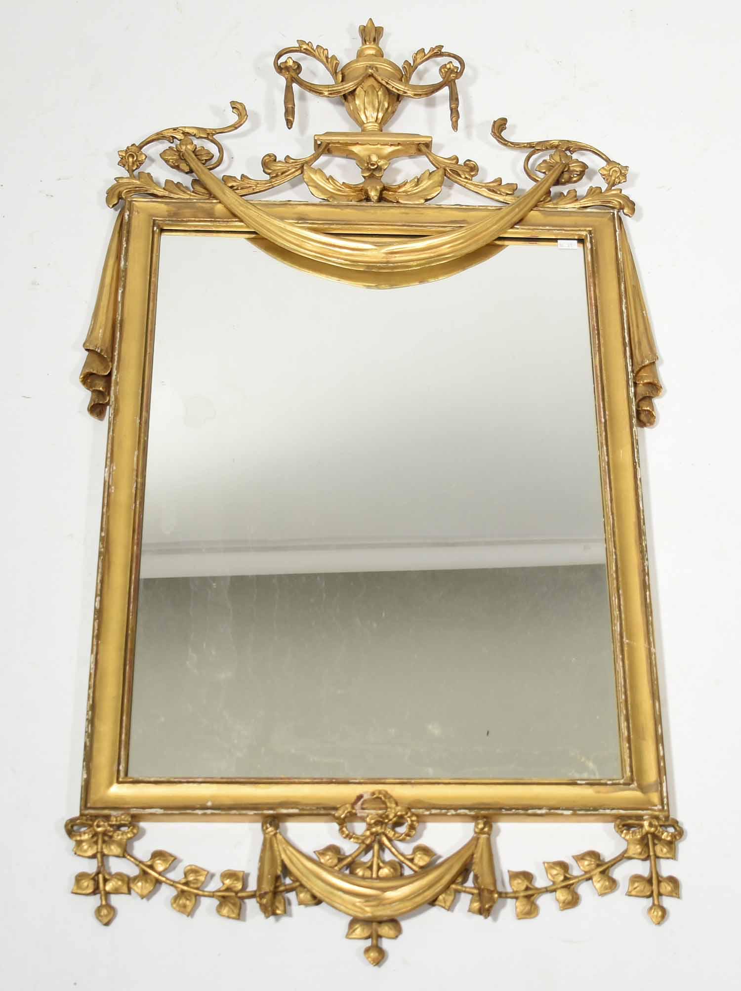 Reproduction decorative mirror: Reproduction decorative mirror with urn design crest, 44"H. x 23"W.