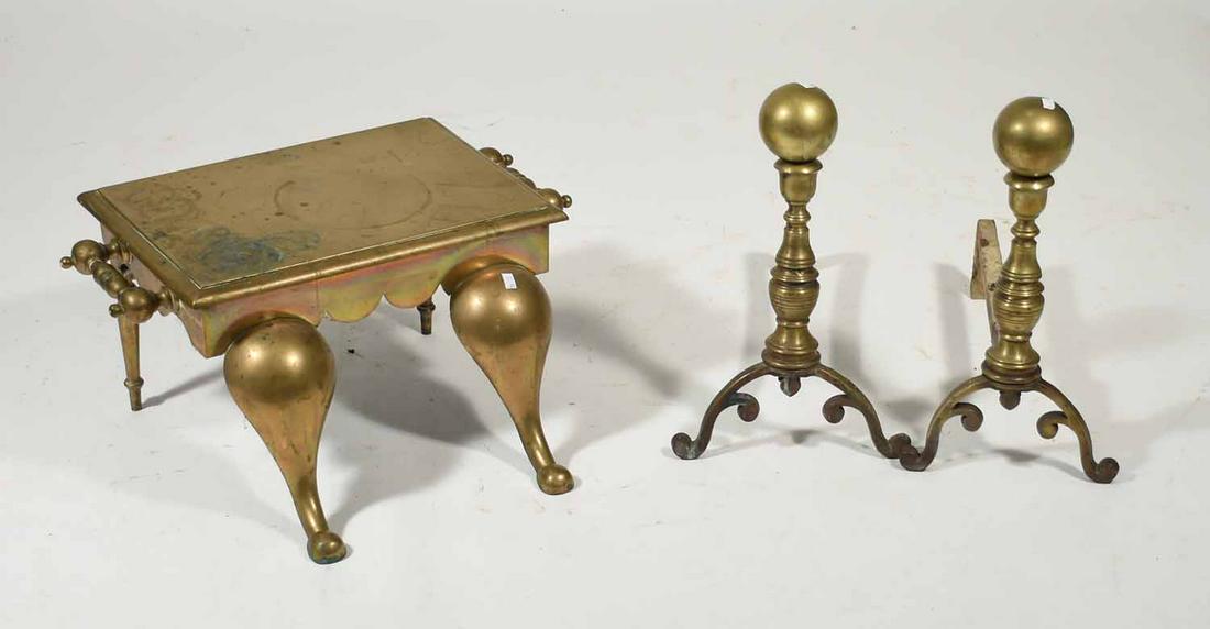 Pr of annonball andirons w/ a brass footman: Pair of Chippendale style cannonball andirons along with a brass footman, 18"L. x 16"H., footman 19"L. x 12"W. x 11"