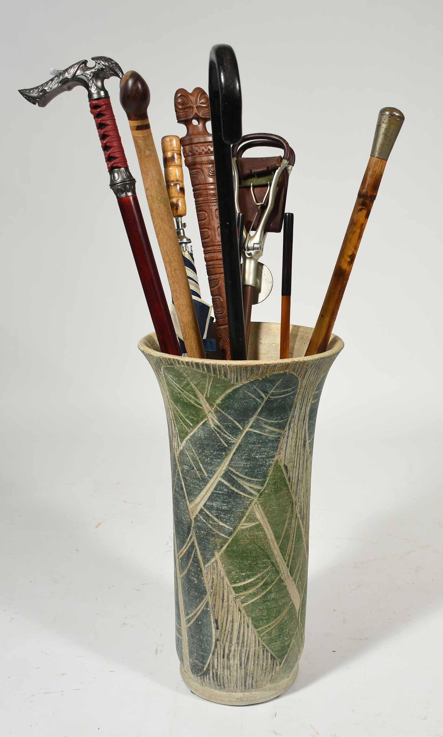 Ceramic umbrella holder with 6 canes & umbrella: Ceramic umbrella holder with 6 canes and umbrella inc., one sword cane, 21.5"H.