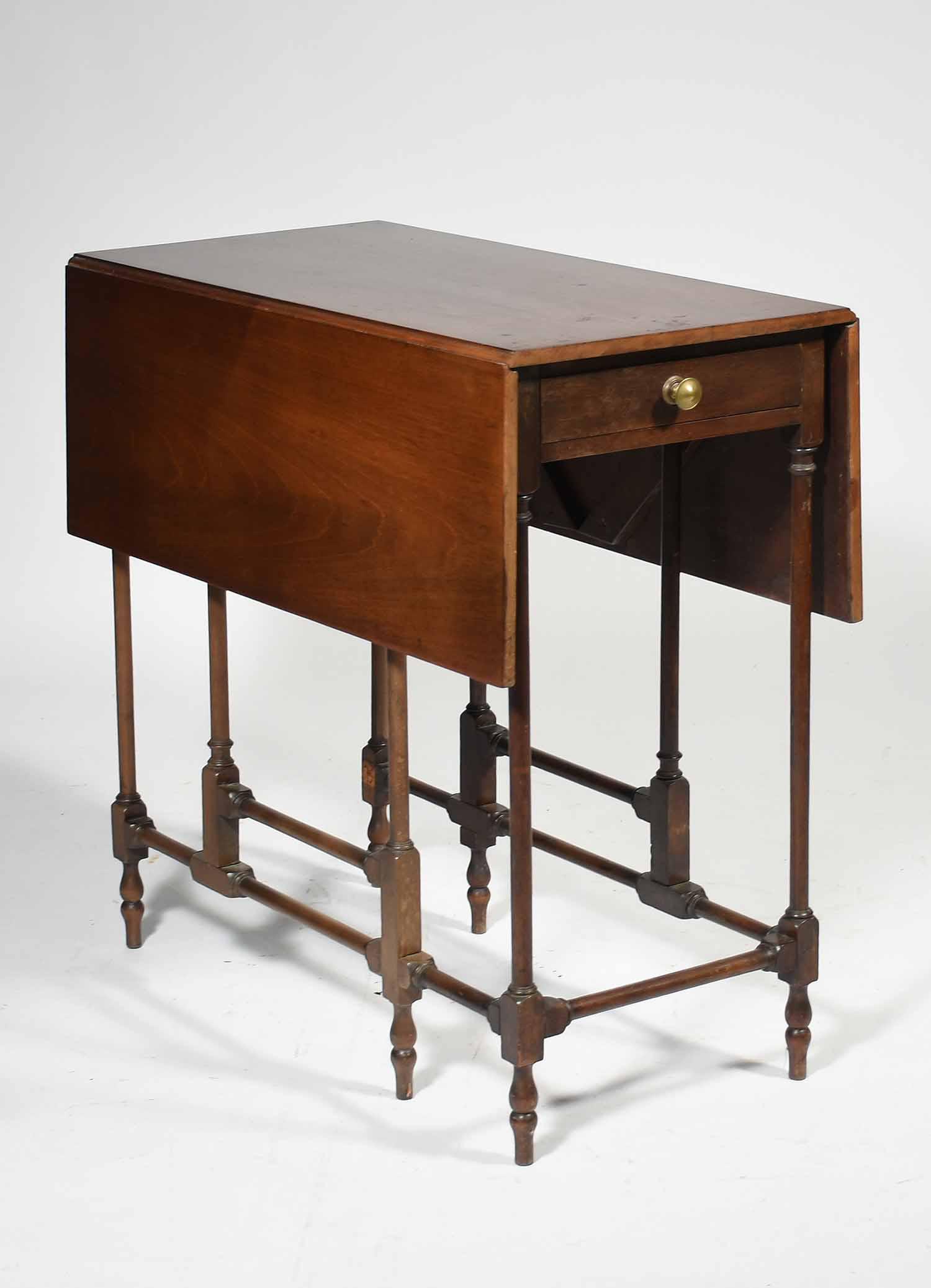 Small Geo. III style mahogany table: Antique Geo III style mahogany spider leg drop leaf table with drawer, 26.5” L X 14” W (closed) 33.5” W (open) X 27” H 