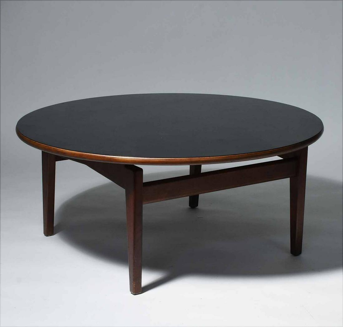 Jens Risom (Danish, 1916 – 2016). Coffee Table: Jens Risom (Danish, 1916 – 2016). Round Walnut Coffee Table with Black Laminate Top, 1960's. With partial designer's label, 16" H, 36" Dia.