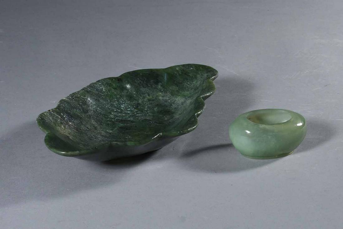 Chinese Spinach Jade Scalloped Low Dish & Jade Brush: Chinese spinach jade scalloped low dish, 19th C., together with a Chinese oval pale green jade brush rinser, The first height 1 3/8", length 8 1/4", width 4 7/8". The second height 1", length 2 3/4", 