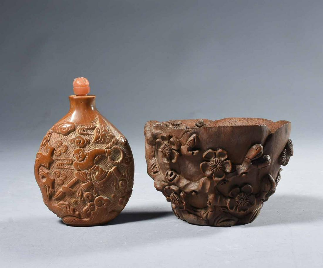 Chinese Bamboo Libation cup & snuff bottle : Chinese carved bamboo libation cup with foliate decoration together with Chinese carved hardstone snuff bottle. The cup with deep flared petal-form sides with high relief stylized cherry tree blossom 