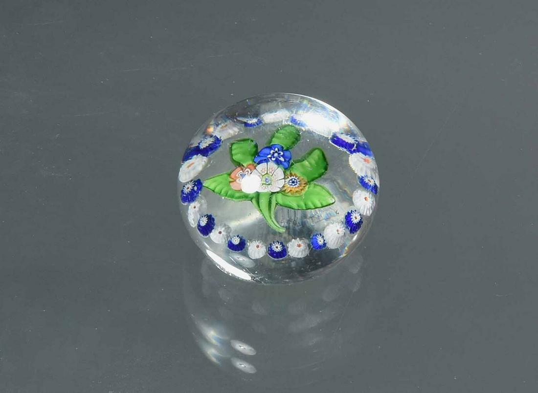 Saint Louis Miniature Flat Bouquet Paperweight: Saint Louis miniature flat bouquet paperweight with garland of millefiori canes, height 1/4", 1 13/16" dia.
