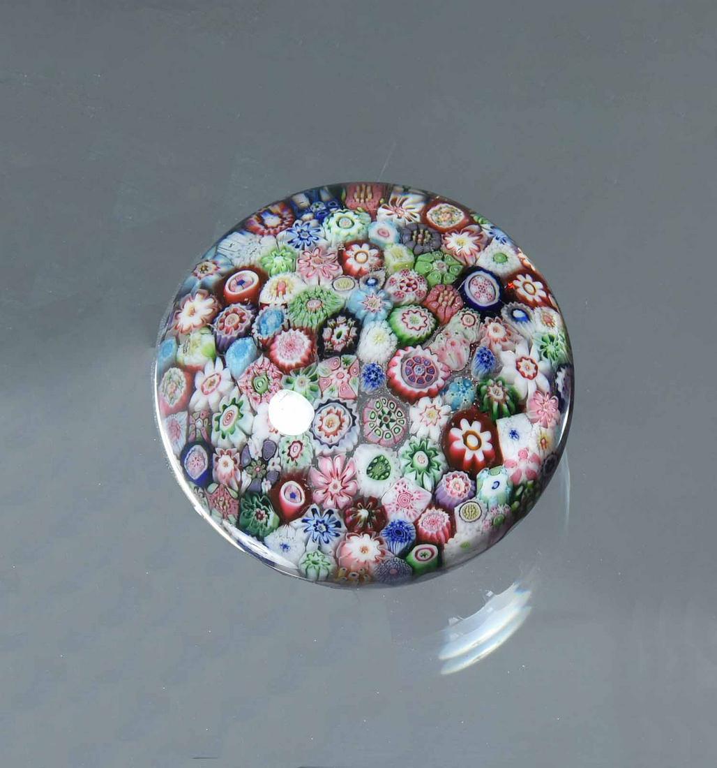 Signed Clichy Close Millefiori Paperweight: Clichy close millefiori paperweight with red and white basket stave base, signed "CÂ" cane, height 1 7/8", 2 11/16" dia.