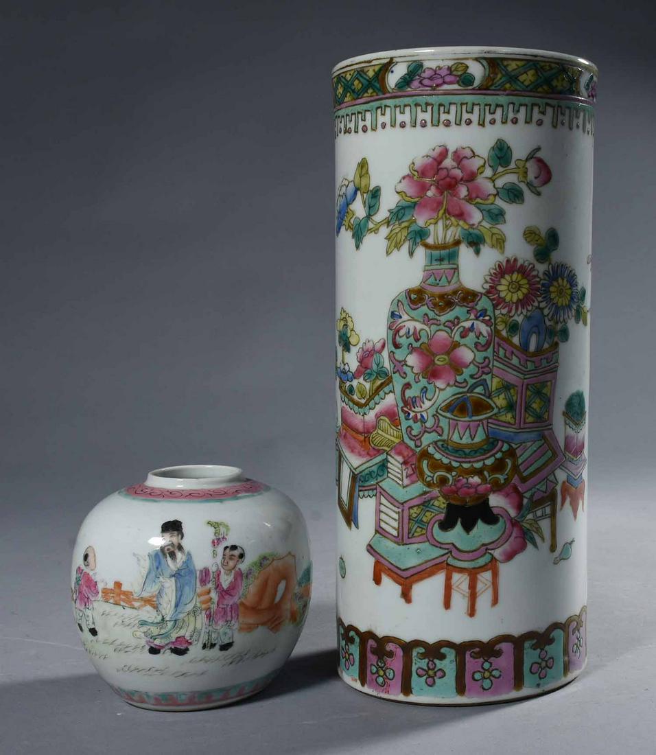 Two Chinese Famille Rose Porcelain Vases: Two Chinese Famille Rose porcelain vases, the first cylindrical form with bouquet in vase enamel decoration with caligraphy on the reverse, height 11 1/4", diameter 5". The second with enamel decorati