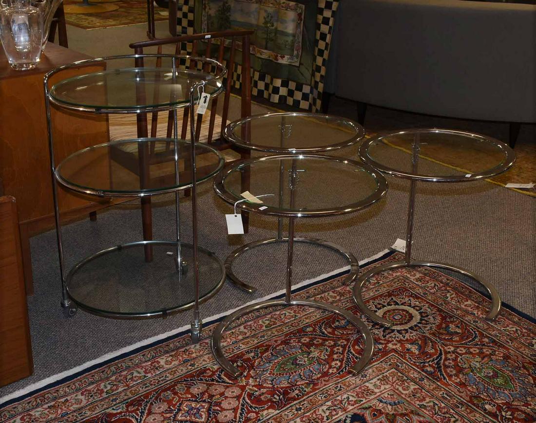 Three matching chrome and glass tables w/rolling: Three matching chrome and glass tables with glass tops along with similar rolling dessert server, 4 pieces - Tables: 21.5” H X 18” dia - rolling piece: 32” H X 19” dia.