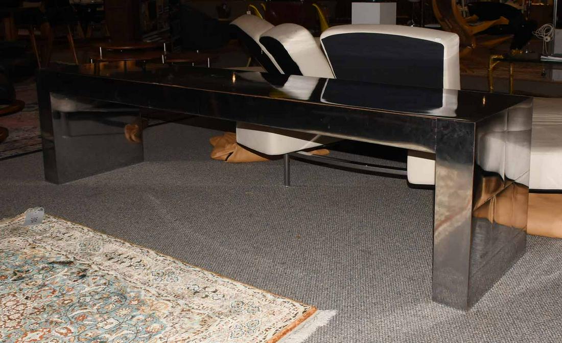 Modernist console in the manner of Paul Evans: Modernist console in the manner of Paul Evans, simulated stainless stainless steel on a wood frame, 22” H X 17.25” D X 80” L