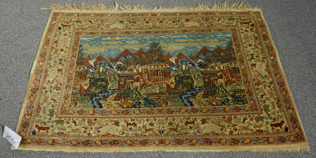 SEMI-ANTIQUE PERSIAN PICTORIAL SCATTER RUG: SEMI-ANTIQUE PERSIAN PICTORIAL SCATTER RUG. Finely woven, the central cityscape pictorial with with flora and fauna in green, copper, and brick red threads with a mountainous background and light blue
