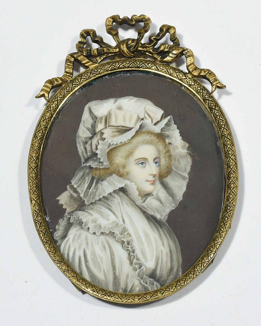 18TH C. ENGLISH SCHOOL MINIATURE PORTRAIT OF A WOMAN IN: 18TH C. ENGLISH SCHOOL MINIATURE PORTRAIT OF A WOMAN IN A WHITE DRESS AND BONNET. Watercolor with gouache highlights, the blue-eyed woman depicted in three-quarter view, in stipple and cross-hatch bru