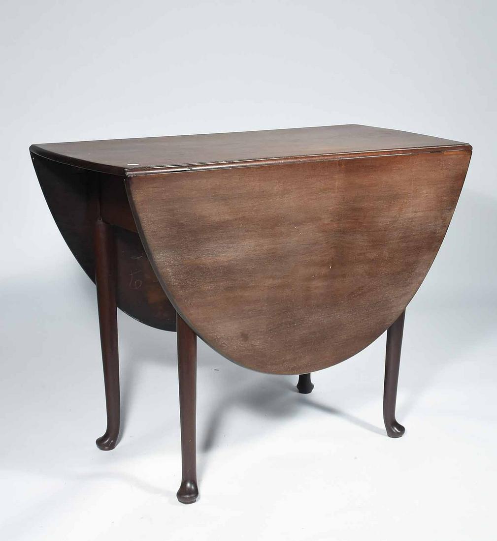 18TH C. ENGLISH QUEEN ANNE MAHOGANY SWING-LEG DINING: 18TH C. ENGLISH QUEEN ANNE MAHOGANY SWING-LEG DINING TABLE. Oak secondary wood with swing legs supporting 1/2 round leaves. 28.5” H x 38.75” L x 17.5” (closed) 56” open