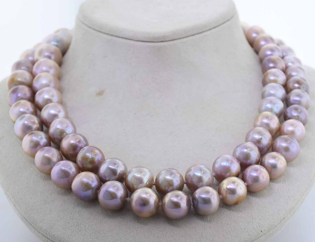 34" STRAND OF COLORED PEARLS: 34" STRAND OF COLORED PEARLS. A continuous strand (no clasp) of 11-12 mm pink colored pearls possibly dyed