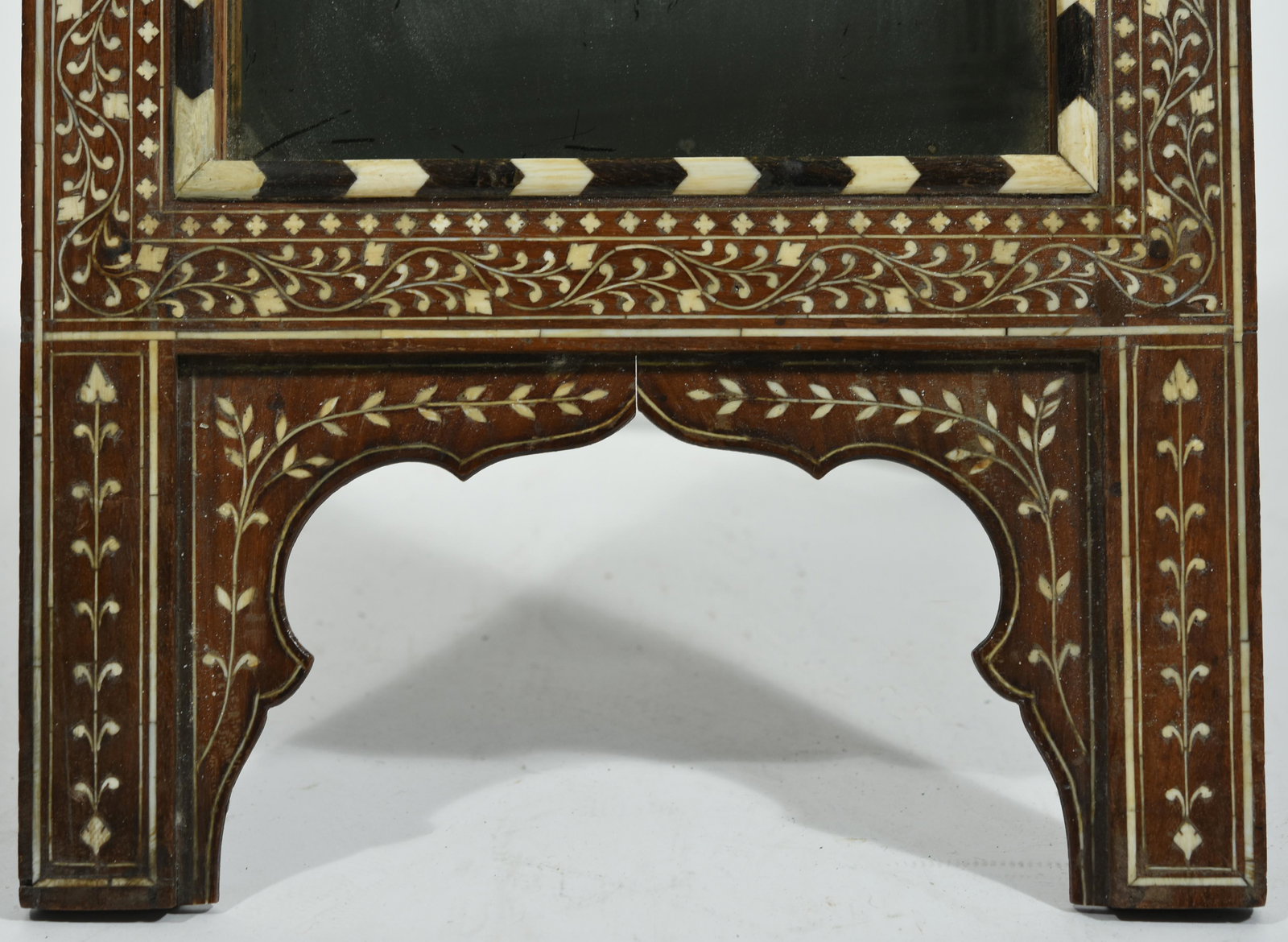 ANGLO INDIAN BONE INLAID DRESSER MIRROR.: Late 19th C. with arched top the mirror with a tambour bone inlaid wood slide with a tripod base, 25”H 12.5” W.