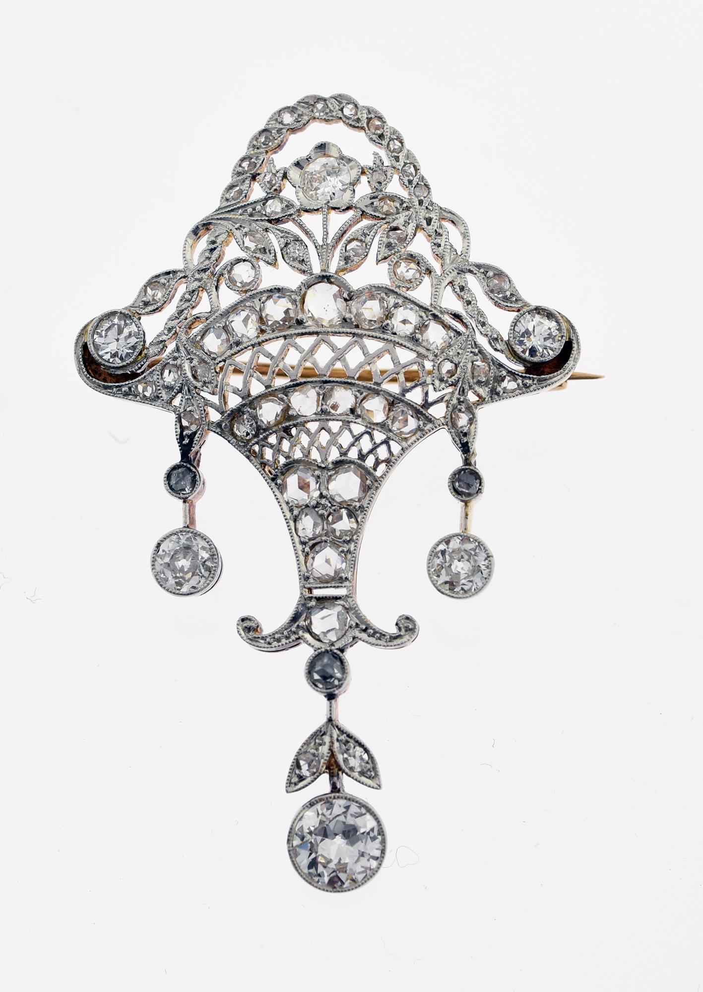 PLATINUM OVER GOLD DIAMOND BASKET PIN.: Filigree basket form set with approx. 2 ctw of old European and rose cut diamonds, approx. 2”L 7.7 grams.