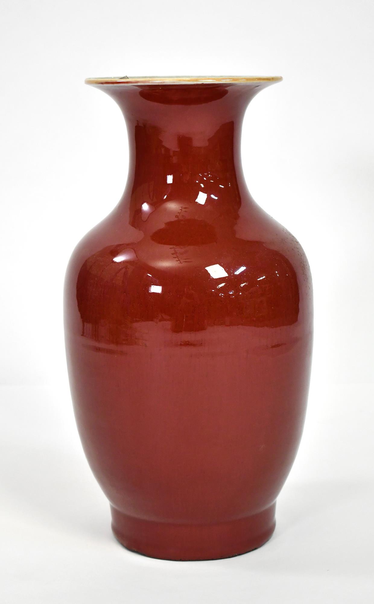 19TH C. CHINESE SANG DE BOUEF VASE:: in a oxblood red glaze with a flared rim. 15.5”H x 8”dia..
