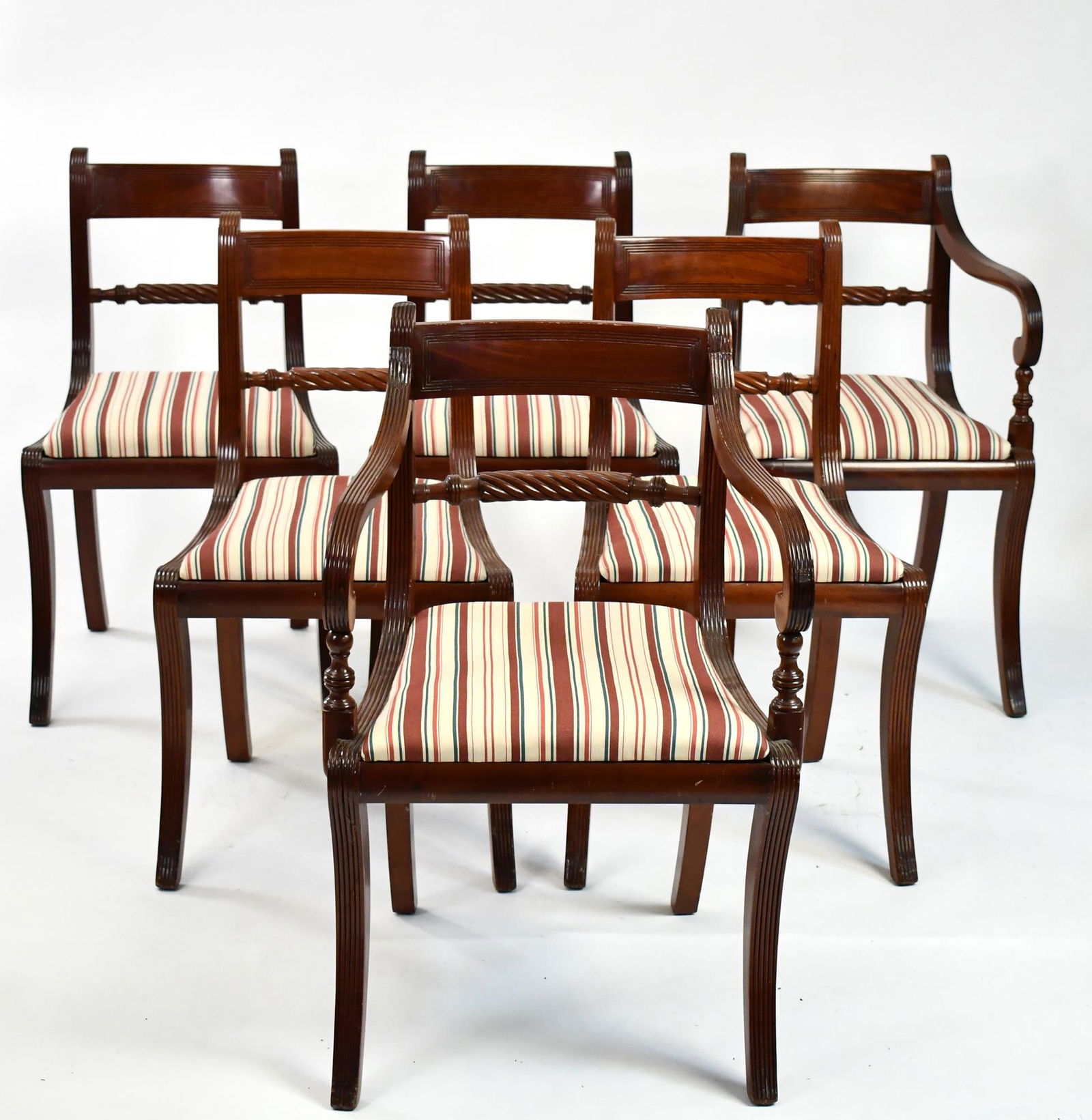 SET OF 6 SABER LEG FEDERAL STYLE DINING CHAIRS.: Mahogany with reeded designs in the manner of Duncan Phyfe, slip seats. 33”H x 22”W x 18” seat- arm 18.5”W sides.