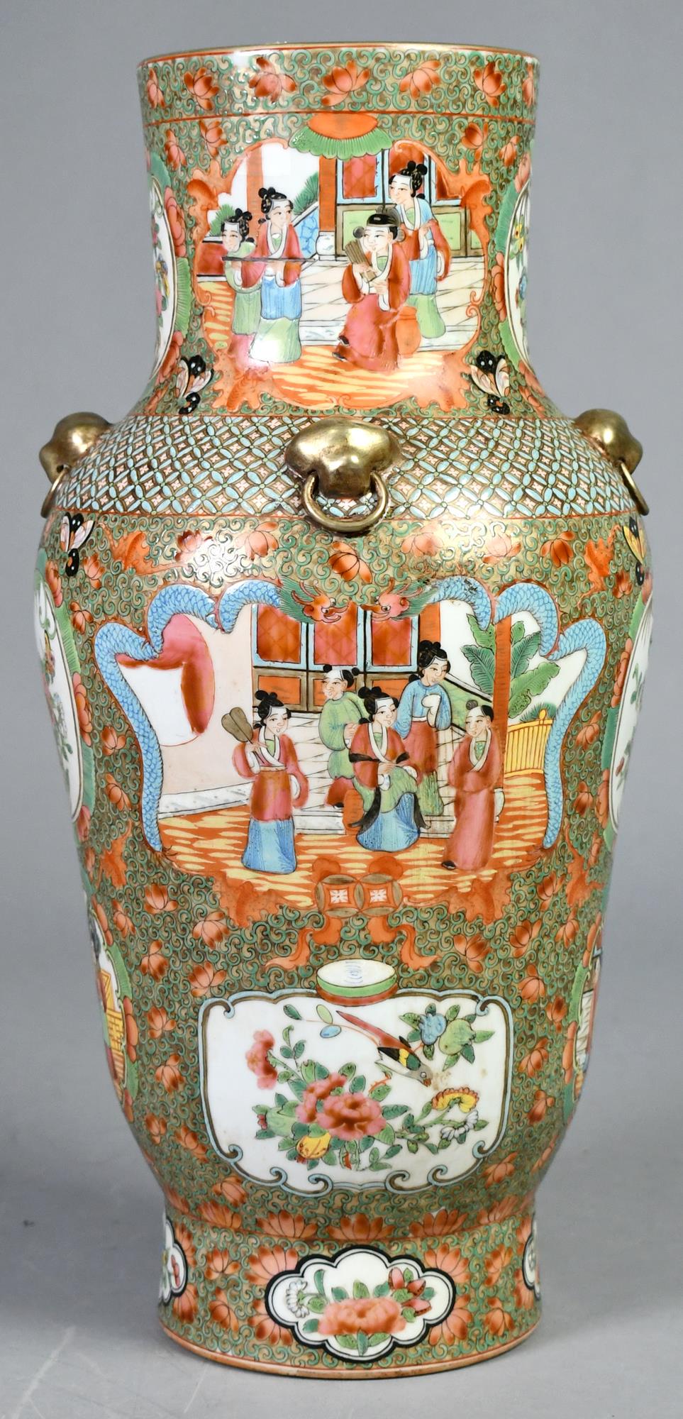 ROSE MEDALLION VASE.: A Rose Medallion vase with an interesting design and color palette, court scene and floral/bird medallion designs and four lions ring handles. 18”H x 8”W.