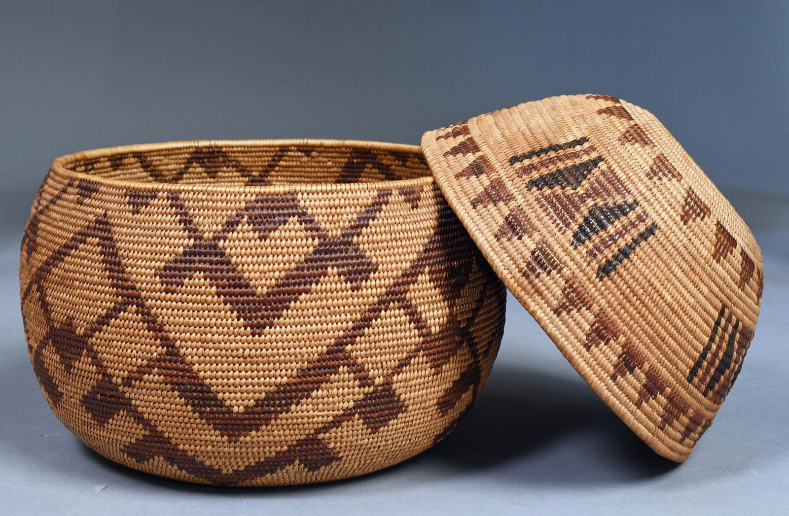 TWO NATIVE AMERICAN WOVEN BASKETS. (1 of 6)