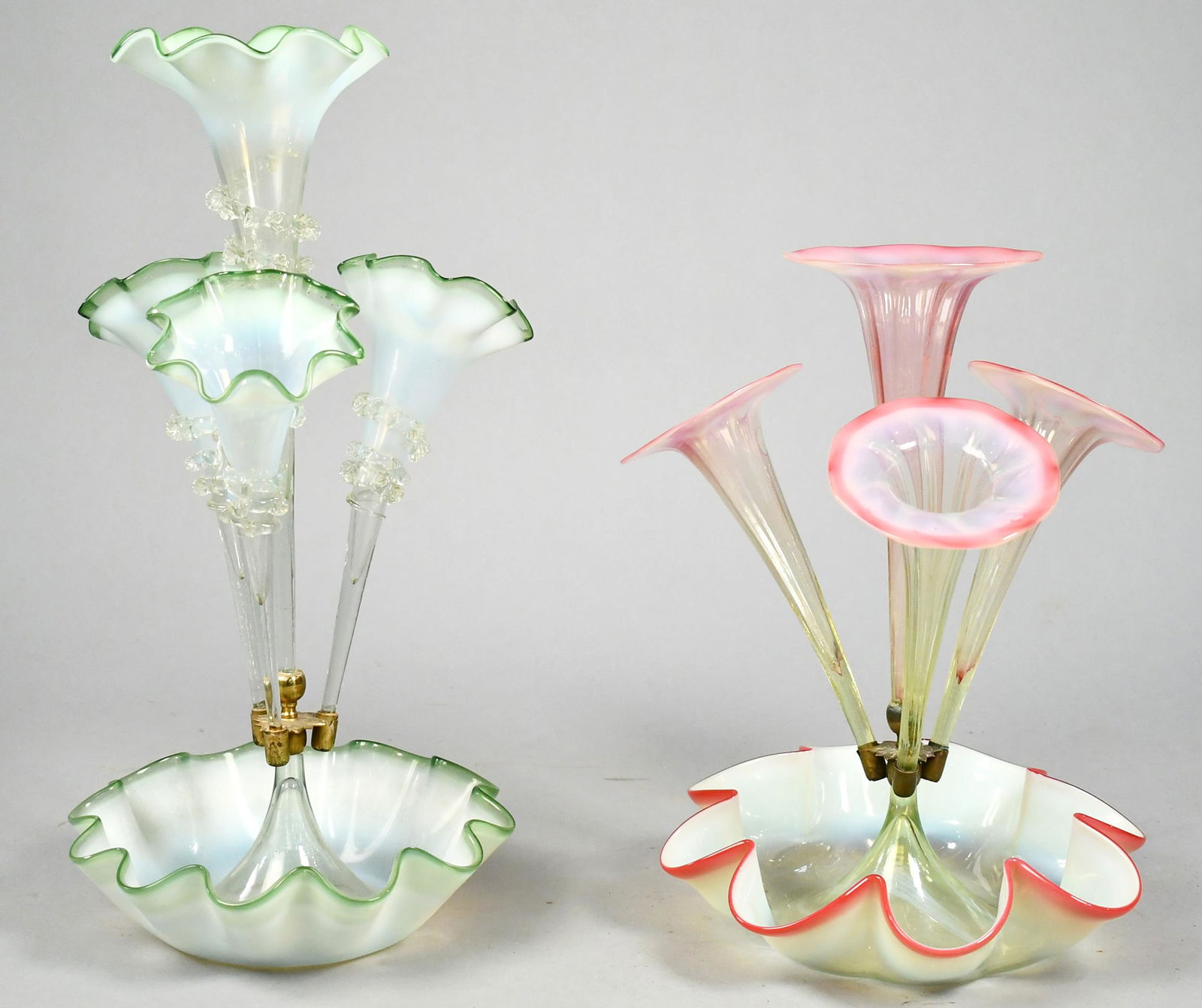 TWO VICTORIAN ART GLASS EPERGNES.: A three stem green to clear opalescent, 19.5”H; and a three arm with center stem, cranberry to clear to green, 15”H.