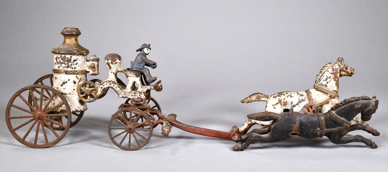 ANTIQUE HORSE DRAWN CAST IRON FIRE WAGON. (1 of 5)