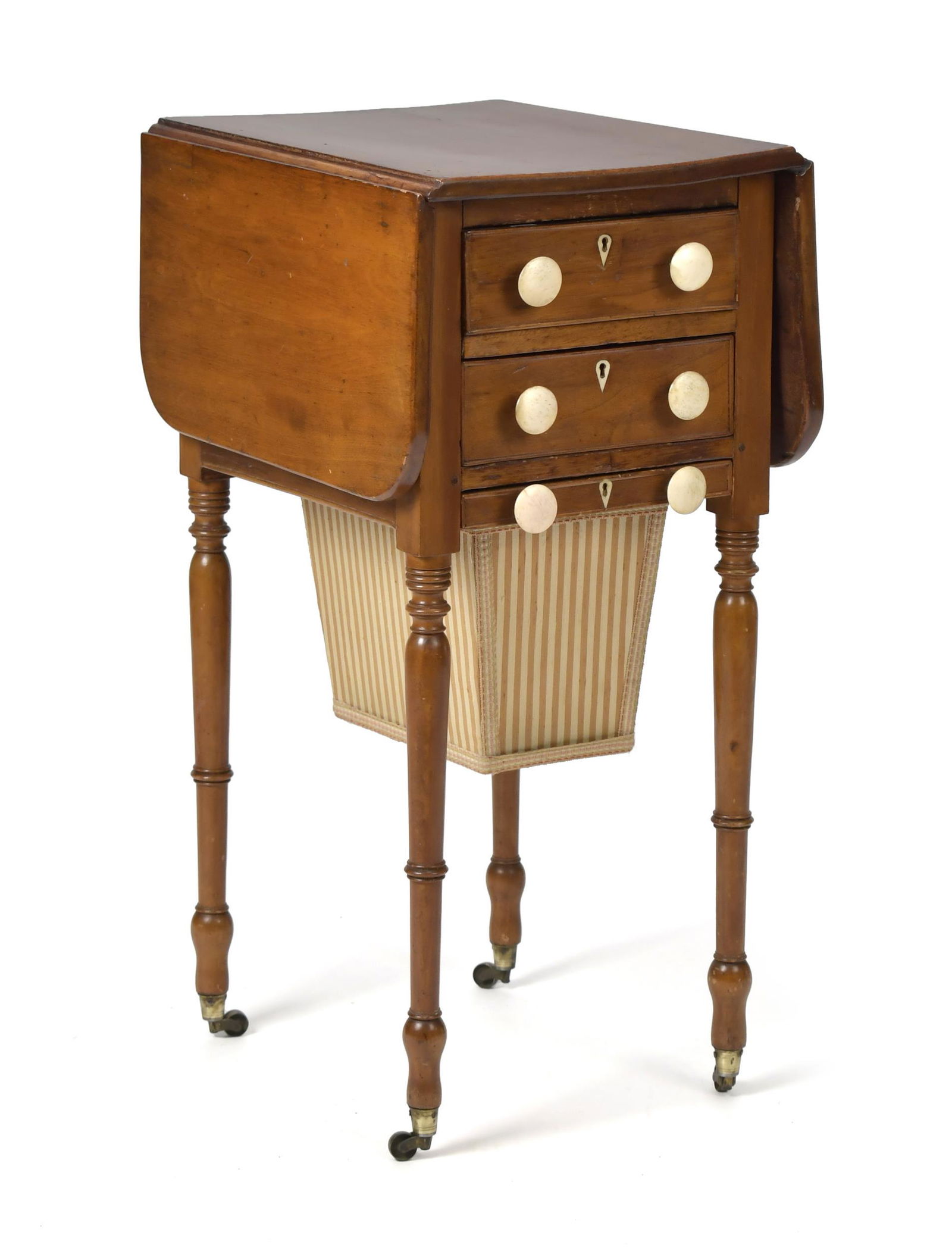 FEDERAL MAHOGANY SEWING STAND.: Ca. 1820 ladies drop leaf sewing stand with two dovetailed drawers, one fitted for spools, and bottom bag drawer, with whale bone pulls, opposite side with identical simulated false drawers, drop leav