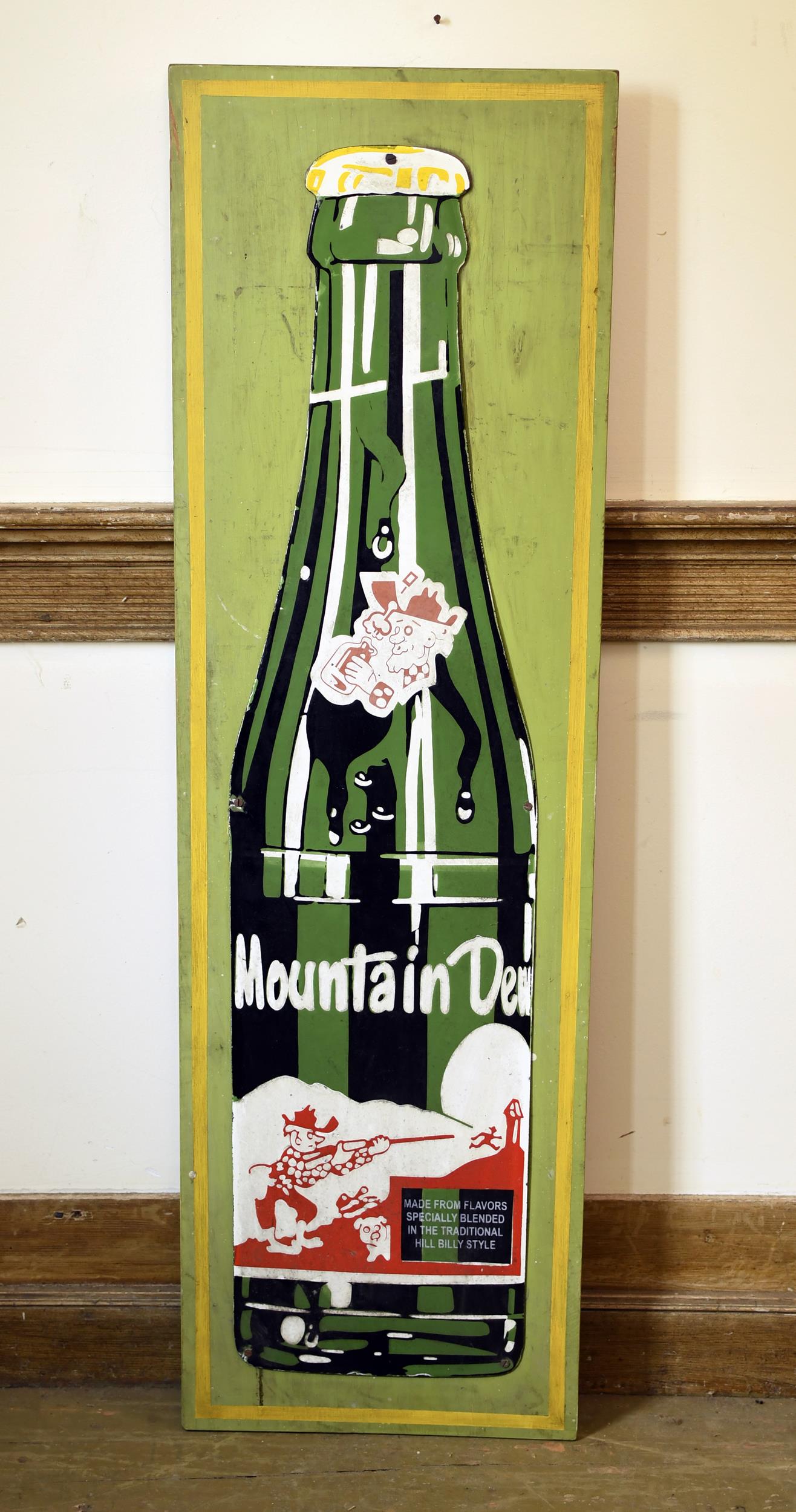 VINTAGE MOUNTIAN DEW ADVERTISING SIGN.: First half of the 20th C. Mountain Dew porcelain metal sign, mounted to wood board. 50”H x 15”W.