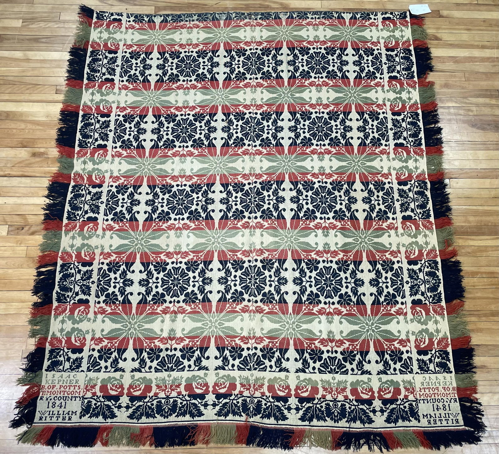 1841 MONTGOMERY COUNTY FOUR COLOR HOMESPUN.: A 19th C. green, blue, red and white homespun, inscribed 'Isaac Kepner of Potts Montgomery County 1841, William Ritter', 75” x 92”.