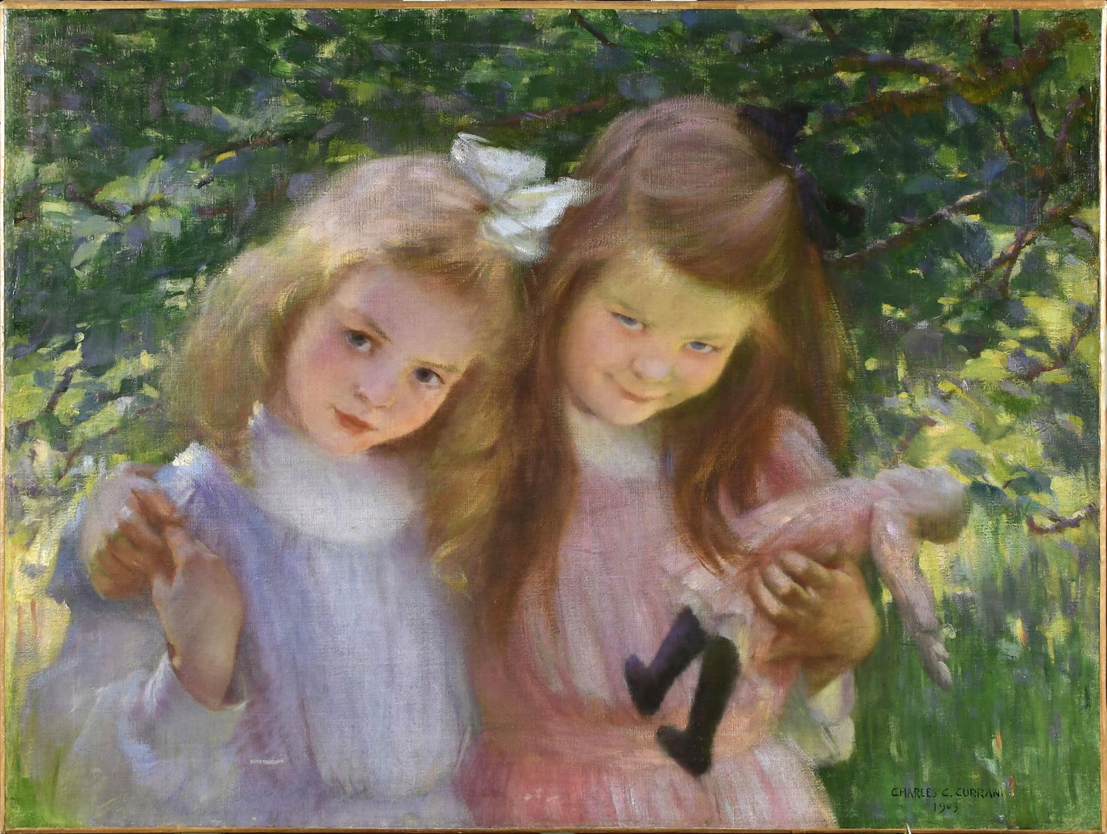 CHARLES C. CURRAN OIL ON CANVAS, TWO CHILDREN.: Charles Courtney Curran (1861-1942) unframed oil on canvas, two girls with a doll in front of green foliage, signed lower right, Charles C. Curran, 1903. Canvas 20” x 27.