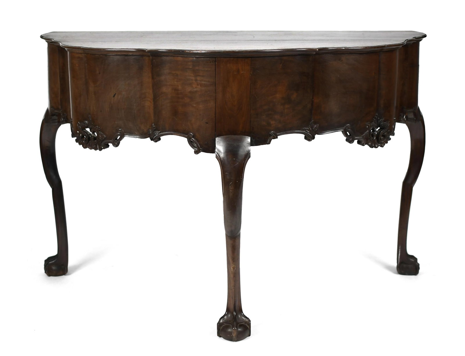 RARE 18TH C. IRISH MAHOGANY PIER TABLE.: A rare ca. 1750-70, scalloped and serpentined deep demi-lune form pier table, with a carved conforming apron raised on three cabriole legs, ending on carved claw and ball feet, 33”H x 51”W