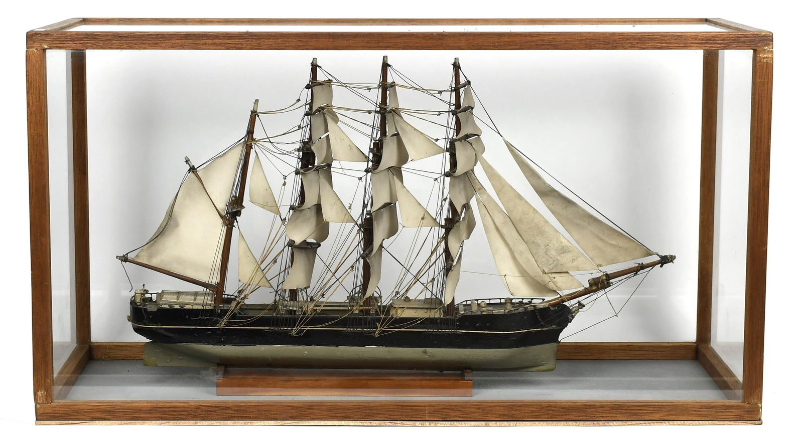 19TH C SHIP MODEL, FOUR MASTED BARK.: An antique hand made ship model of an unnamed four masted bark/ship, in a vintage glass display case, 17.25”H x 32”W x 12.5”D (case).