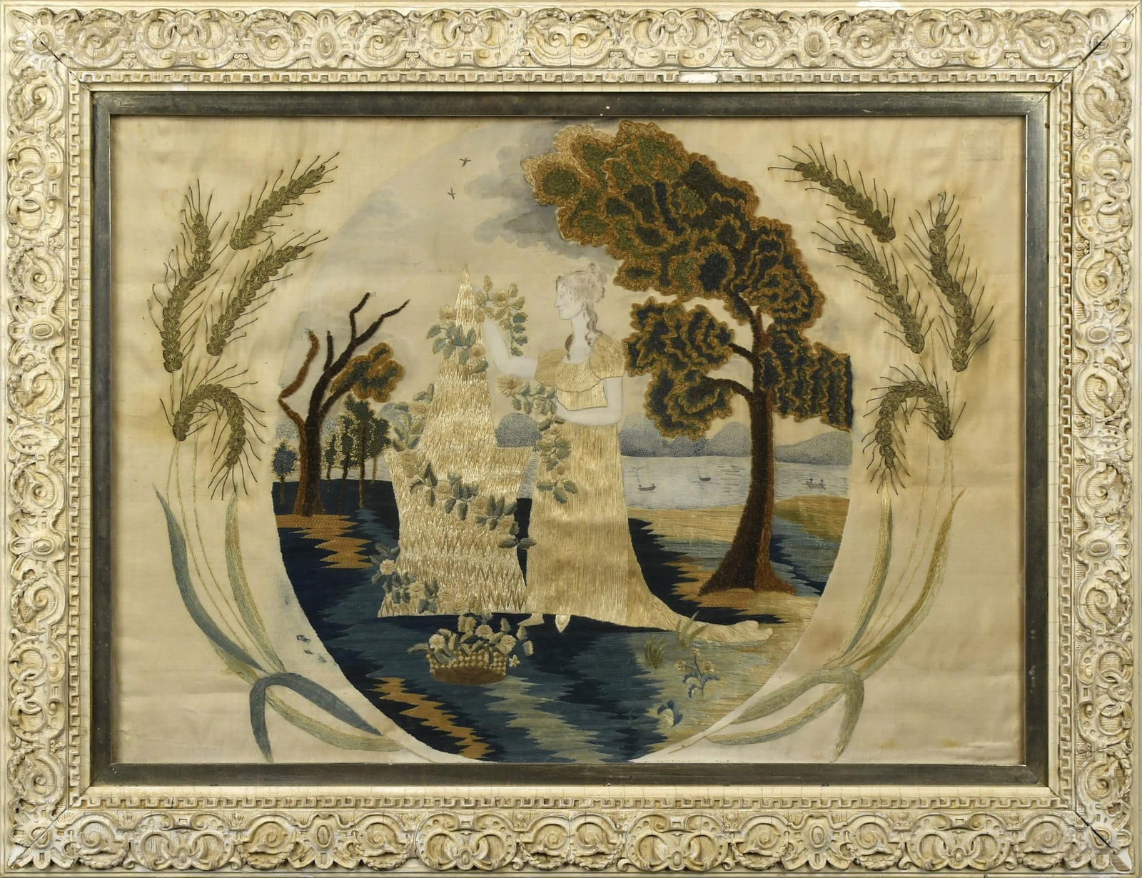 EARLY 19TH C. SILK MOURNING SCENE NEEDLEWORK.: Silk embroidery and crewel needlework, highlighted with metallic threads on ivory silk ground, scene depicts a young female figure adorning a tombstone on lakeside, Image 14” x 20”, Overal