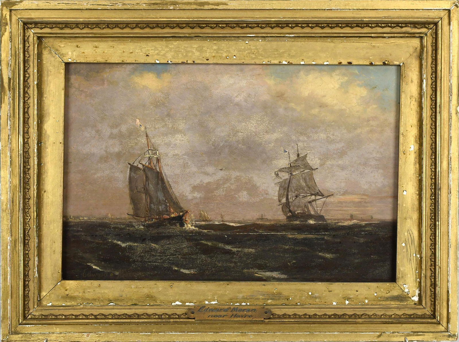 EDWARD MORAN OIL ON BOARD, NEAR HAVRE.: Edward Moran (1829 - 1901) oil on wood board, two ships in full sail, signed lower left, Edward Moran. Frame plaque reads Edward Moran, Near Havre. Board 8” x 12”, Overall 11.5” x 15
