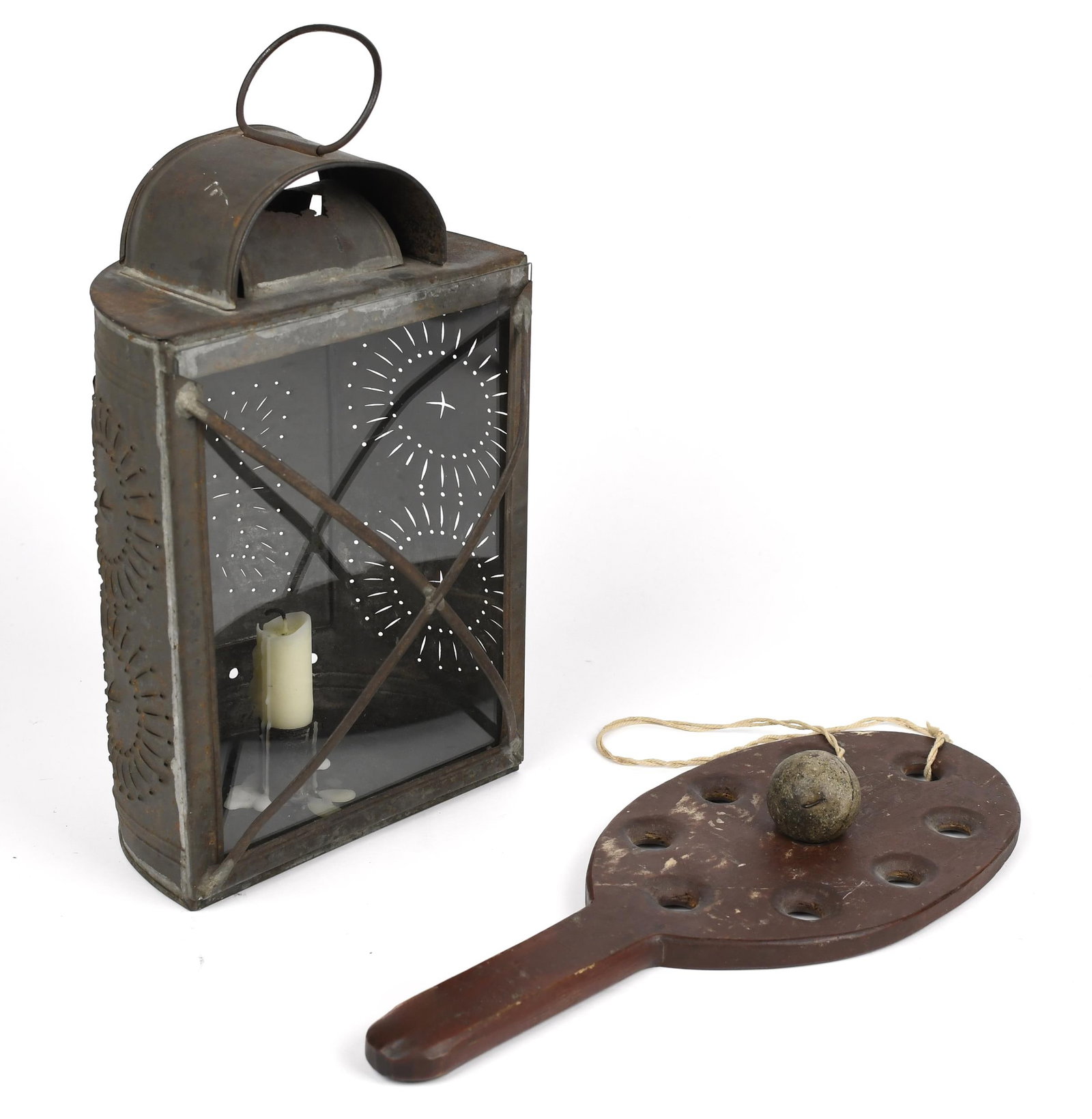 19TH PA. PIERCED TIN LANTERN WITH WOOD RACQUET TOY.: Ca. 1850, pierced tin half round candle lantern with a glass front and metal guard, 12”H x 7.25”W x 4.5”D. A late 19th C. red painted wood racquet toy, 14”L x 6”W.